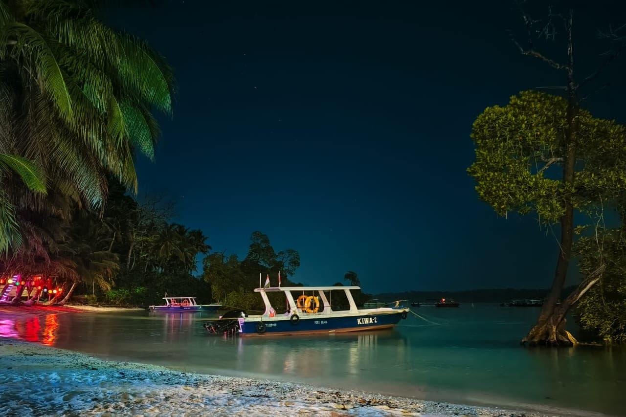 Dive boats moored off the beach at last light